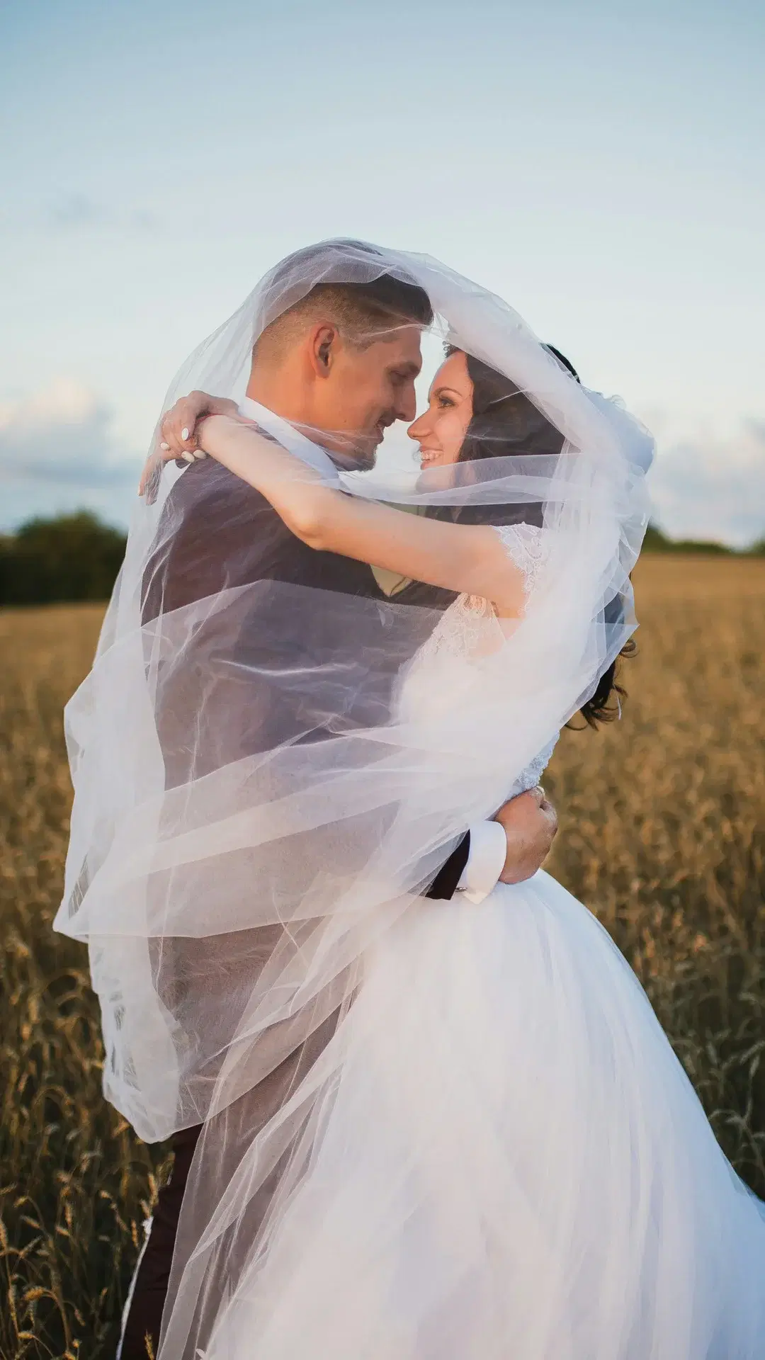 Couple kissing in field